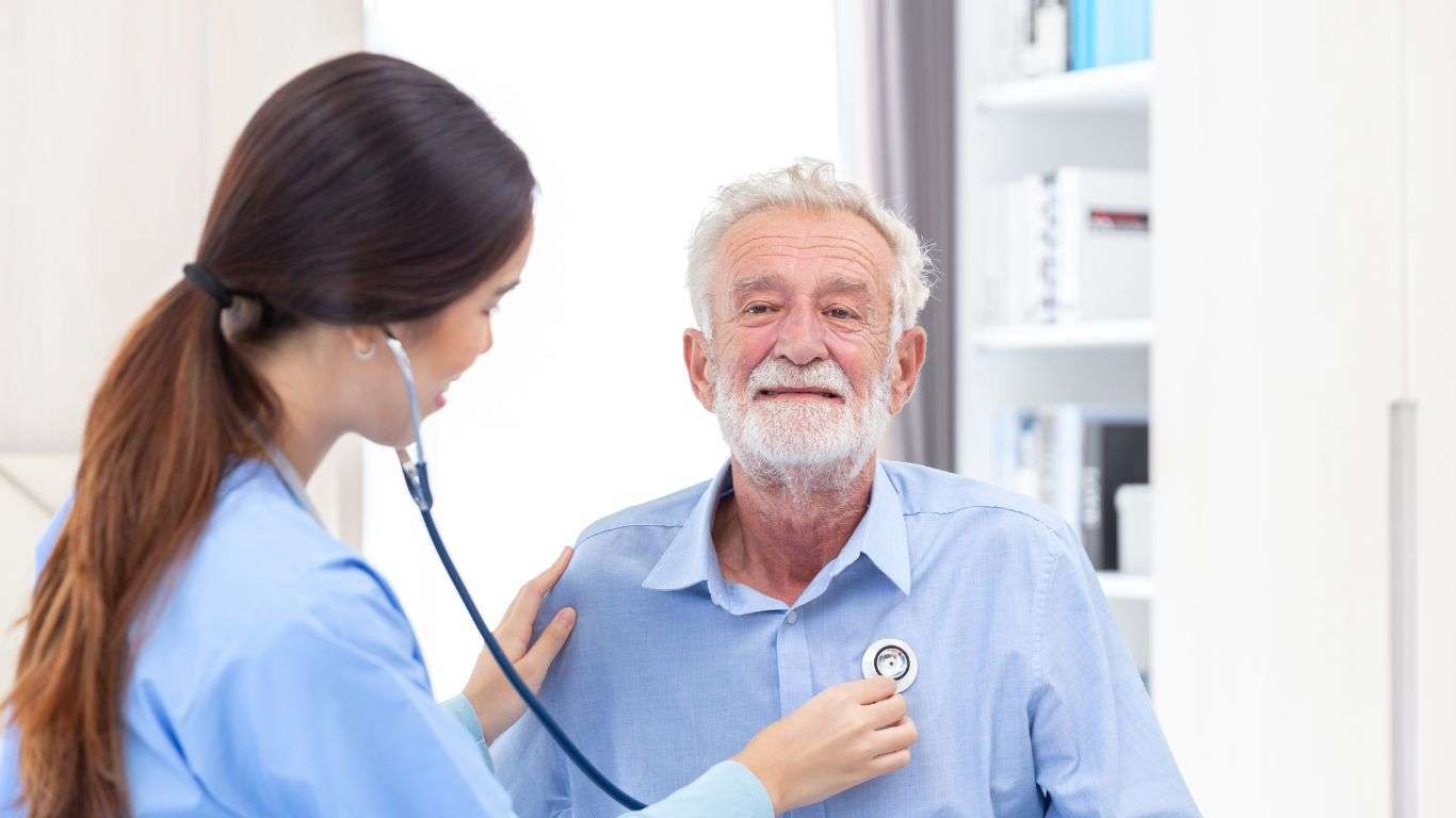 senior male patient cardiovascular care check by a young female doctor or nurse